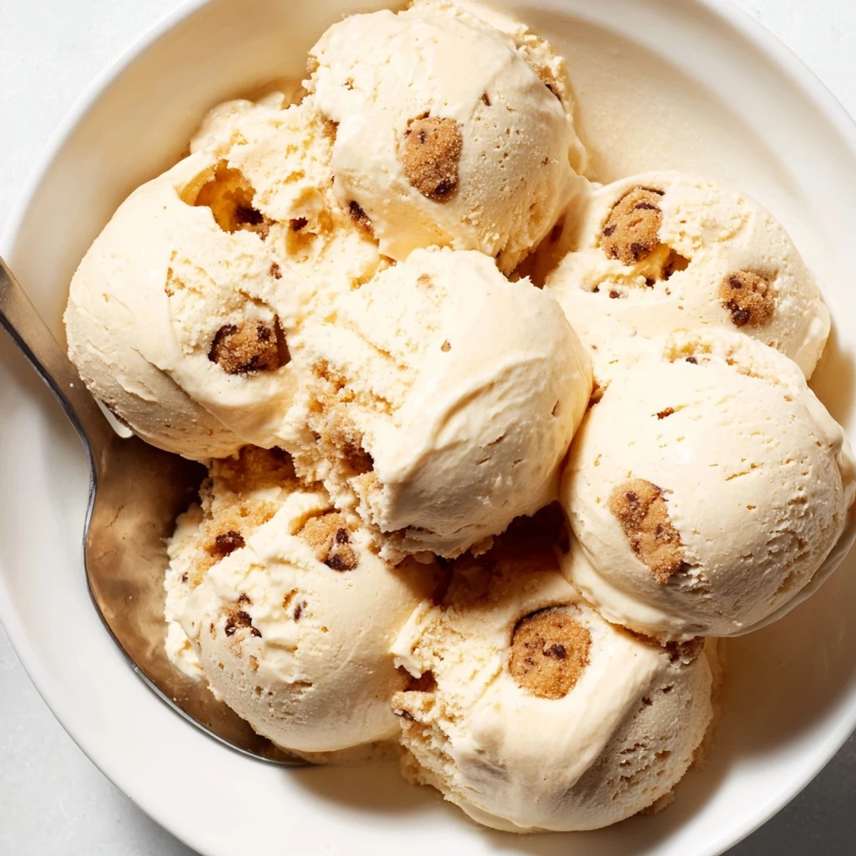 Guilt-free cottage cheese ice cream topped with sweet chocolate chip dough balls.
