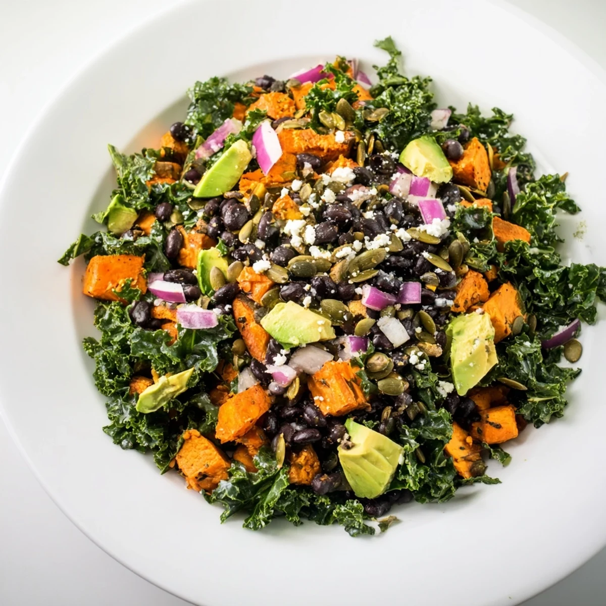 Tender kale beautifully complements the flavors in this fresh and flavorful Massaged Kale Salad dish.