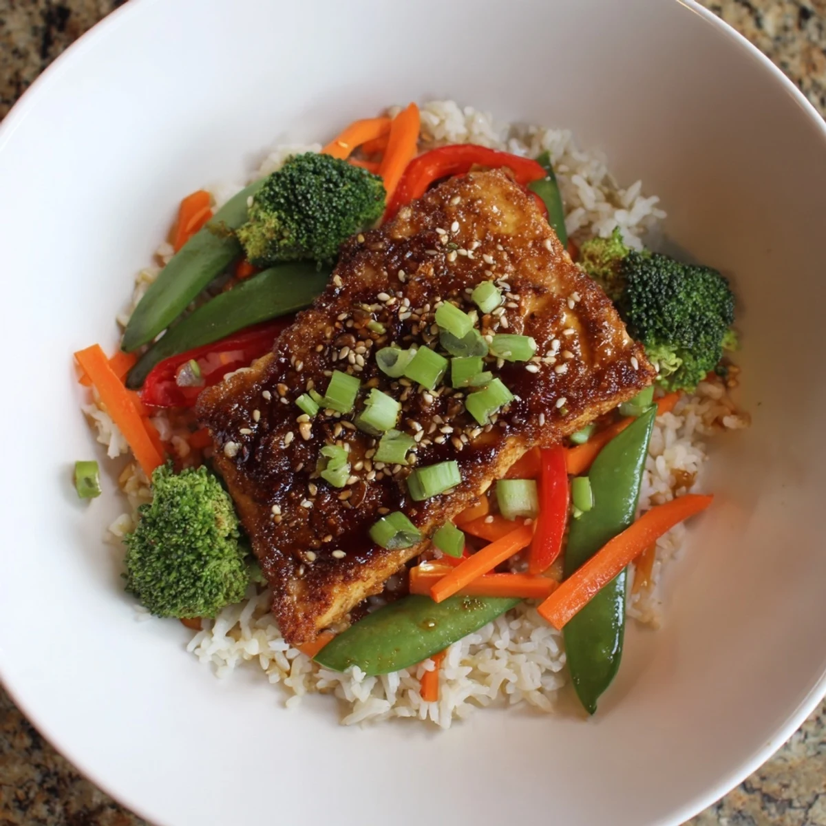 A close-up of beautifully seared tofu steaks, part of a delicious stir-fried meals with rice.