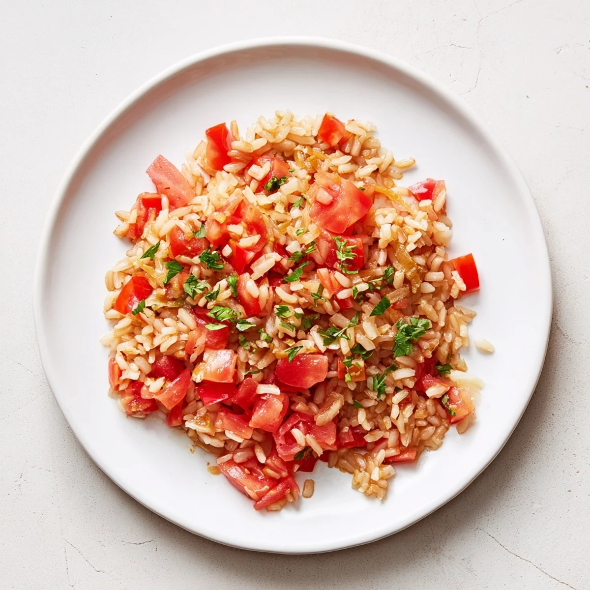 A one-pan Tomato-Rice Skillet Dinner boasts savory aromas, perfect for a quick, comforting weeknight meal.
