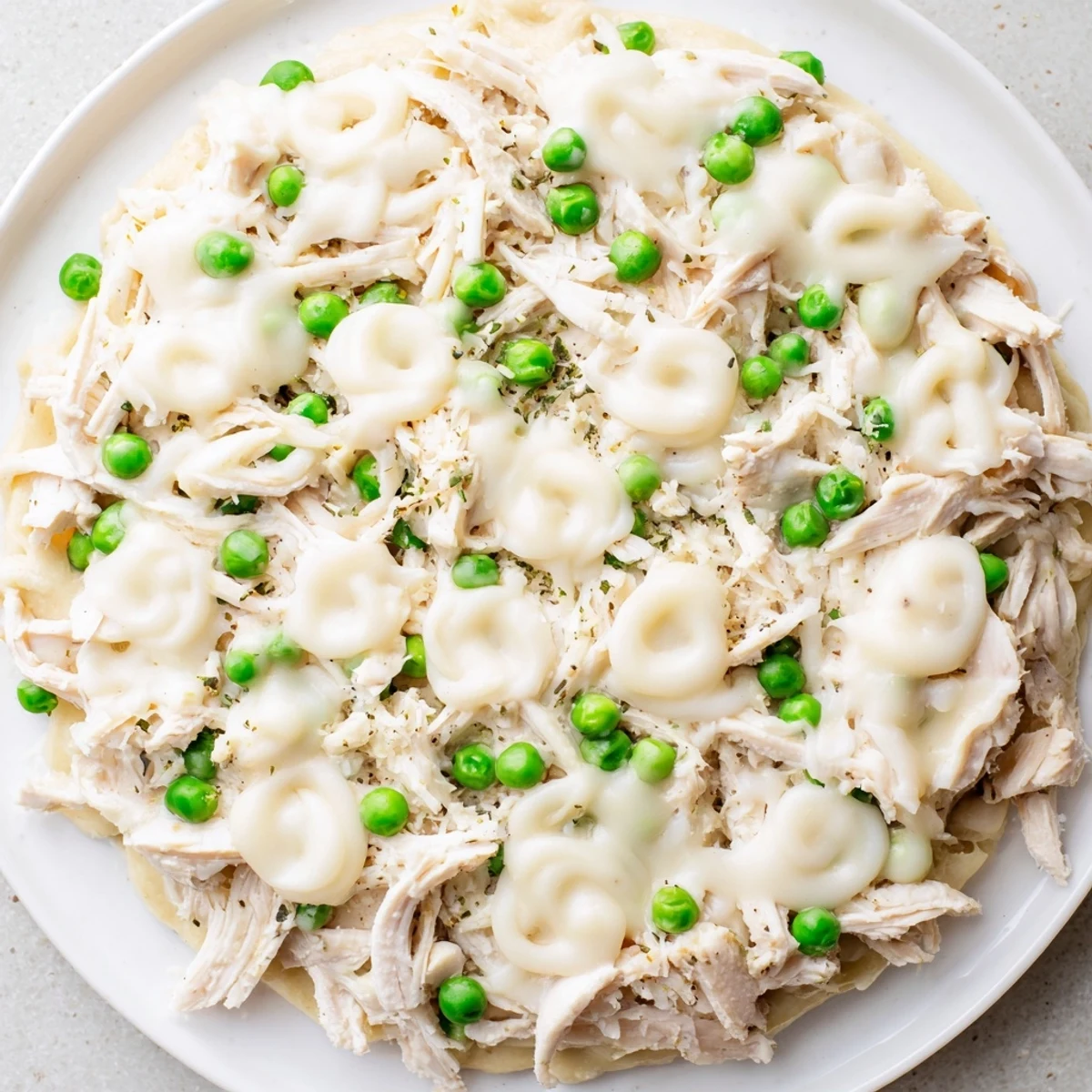 Slow-cooked, creamy Chicken Alfredo shows off a comforting Italian-American slow-cooker meal suggestion.