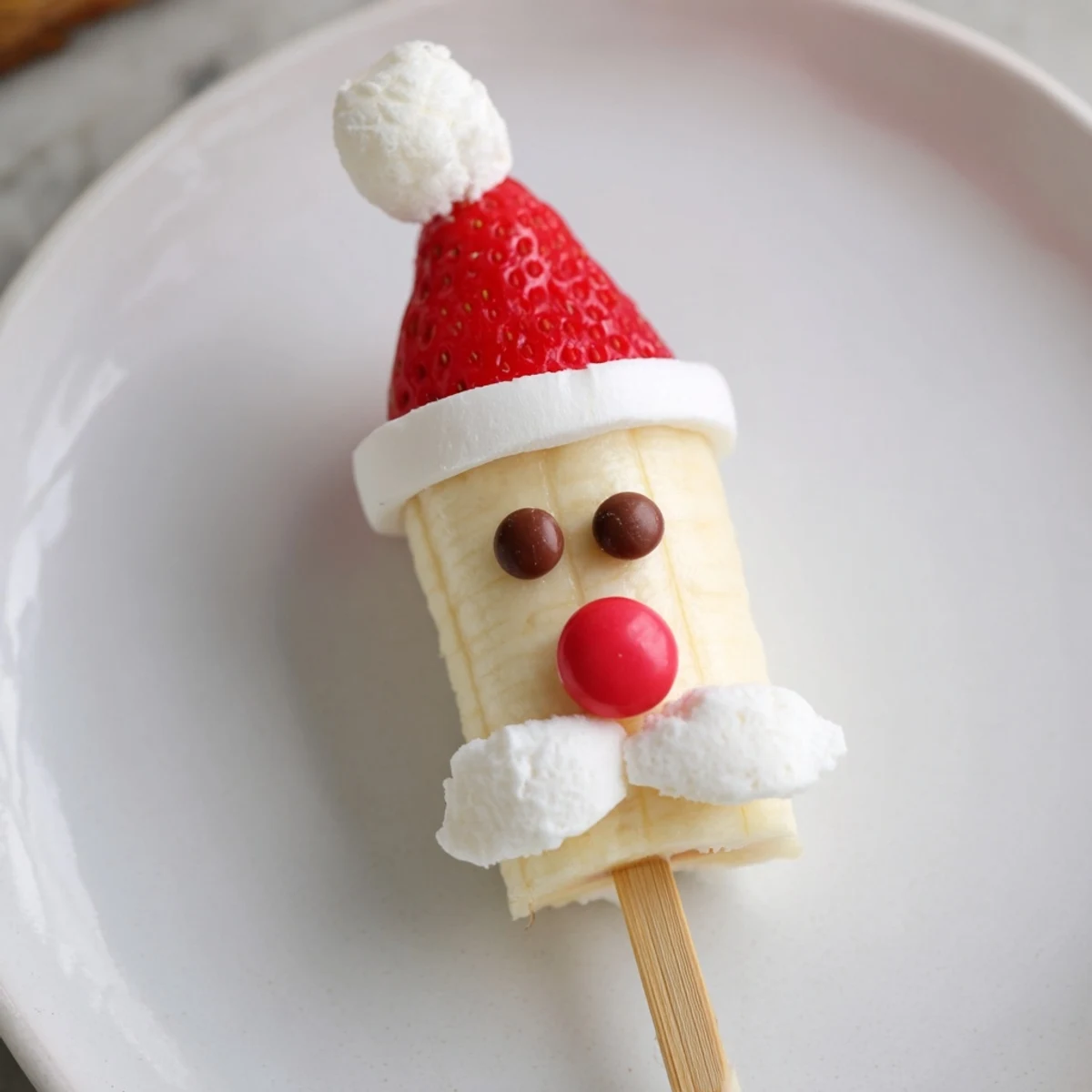 Brightly arranged Banana Santa Snack Sticks, ready to serve, a delightful American holiday dessert idea.