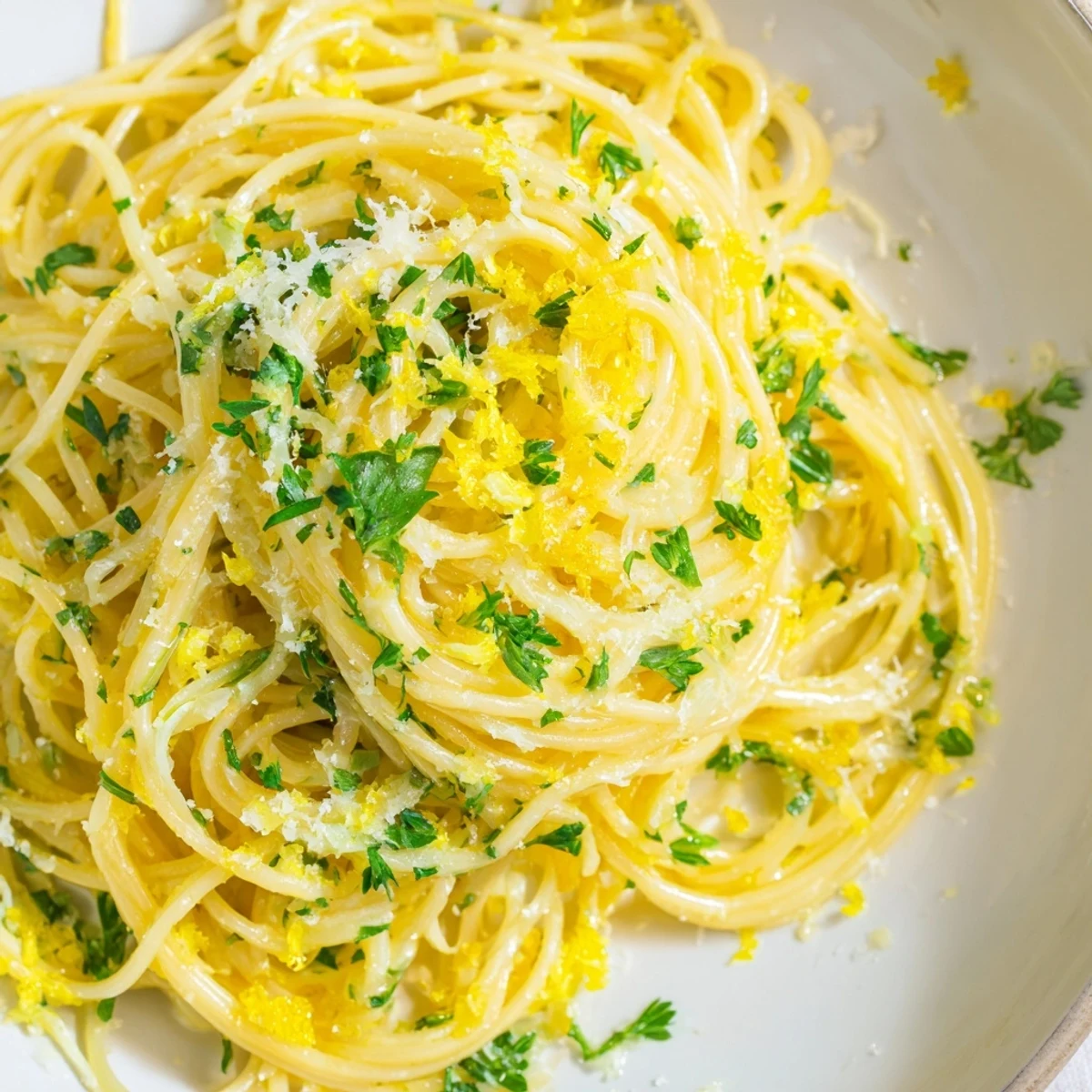 Steaming bowl of Lemon Capellini with fresh herbs, a bright and flavorful Italian pasta dish.