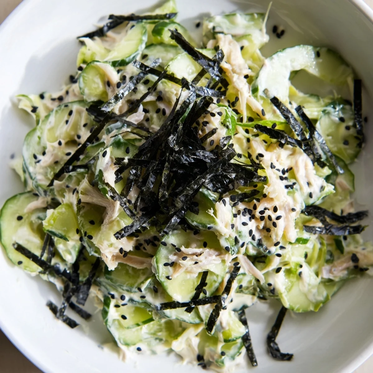 Vibrant California Roll Cucumber Salad: Cool cucumbers, imitation crab, and creamy dressing, ready to eat.
