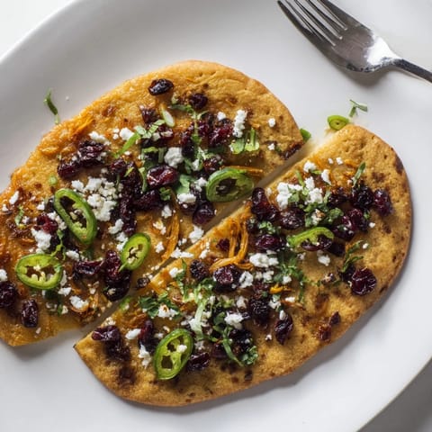 Delicious ginger cranberry jalapeño flatbread, perfect for appetizers and gatherings.  