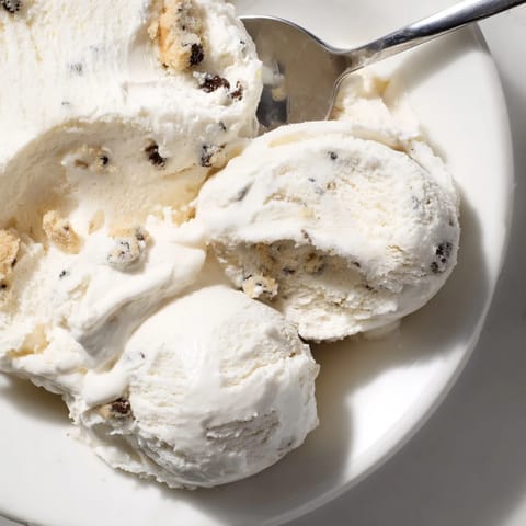 Decadent cottage cheese ice cream swirled with rich edible cookie dough chunks.  