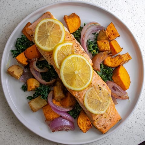 Golden-brown Sheet-Pan Salmon, fresh from the oven, alongside tender, roasted winter veggies.