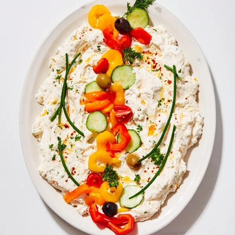 A festive platter of Christmas Lights Appetizer Spread; creamy cheese dots with veggie "lights," ready to serve.