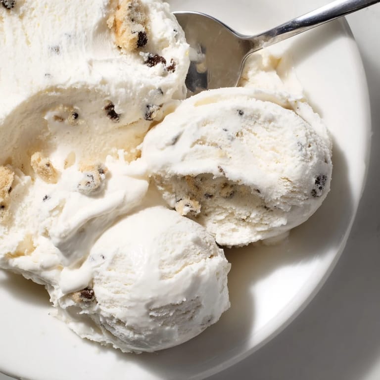 Decadent cottage cheese ice cream swirled with rich edible cookie dough chunks.  
