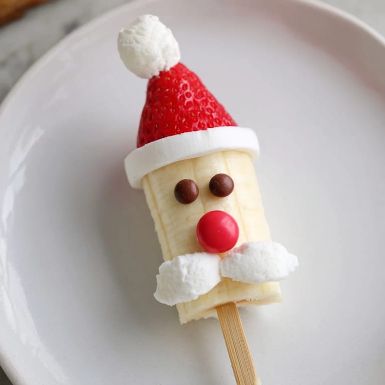Brightly arranged Banana Santa Snack Sticks, ready to serve, a delightful American holiday dessert idea.